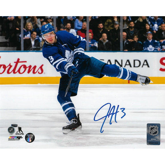 Justin Holl Autographed Toronto Maple Leafs 8X10 Photo (Shooting)